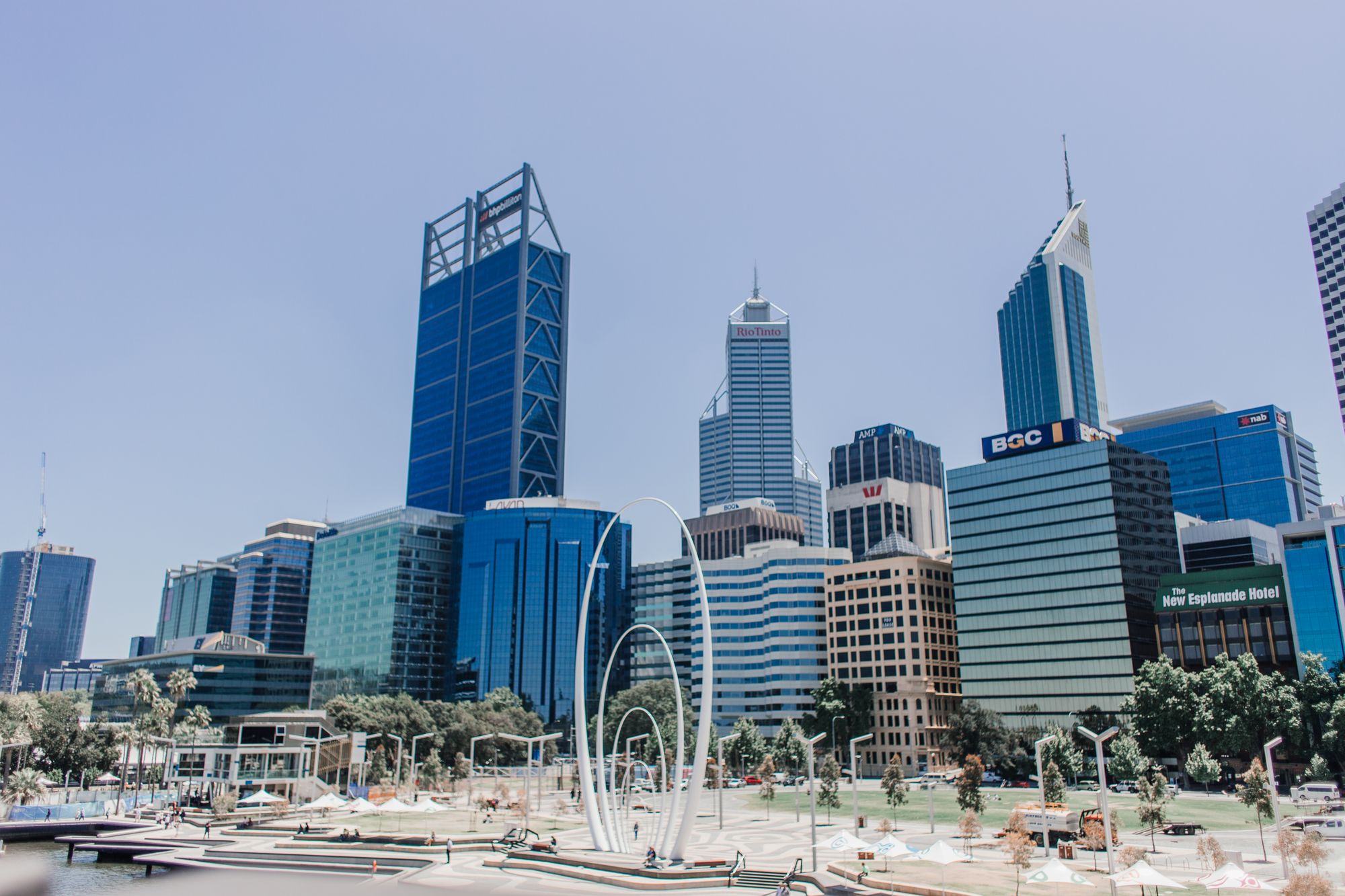 Perth city skyline under a clear blue sky.